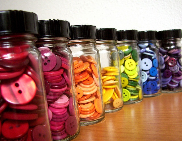 Make use of mason jars to store the buttons, thread, pins, etc.