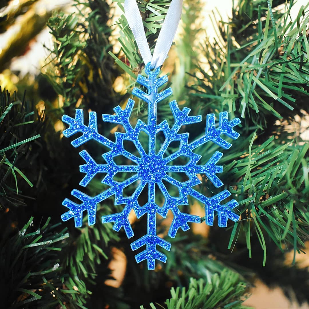 Beautiful sparkly blue snowflakes made by hazelnut.laser.crafts