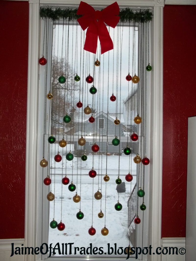 Hang Some Christmas Ornaments Into the Window.