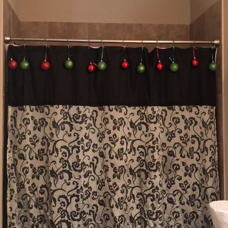 Hang festive ornaments from your shower curtain rings for a fun way to dress up a plain shower curtain.