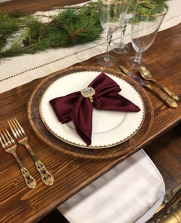 Incorporating a holiday napkin fold into your table design.