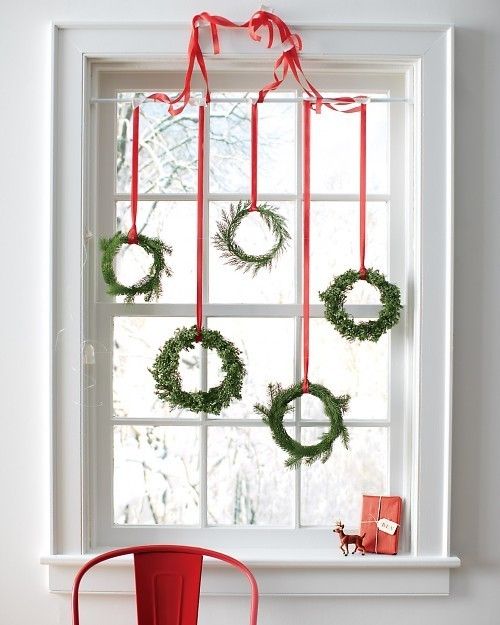 Lovely Green Wreaths Hung on Window’s Top.