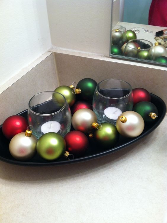 Used a tray & candles that was already in the restroom took away the rocks & added Christmas Bulbs!