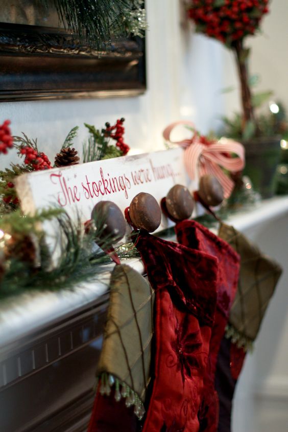 White Wood With The Red Writing DIY Stocking Holder.