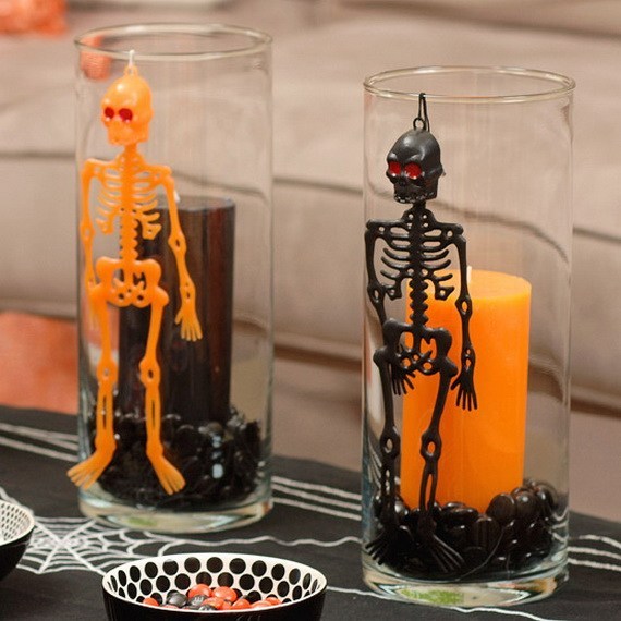 Beautiful black and orange hanging skeleton on glass vase