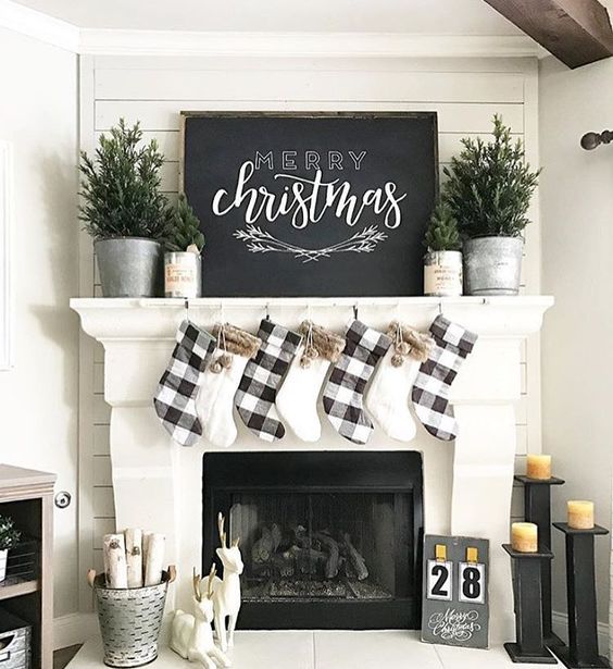 Black and white mantel decor with Christmas wood board