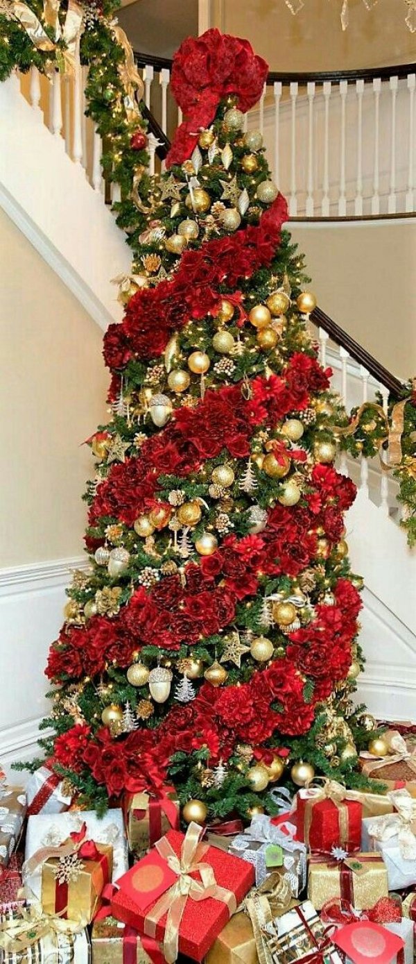 Amazing big red flower on this Christmas tree with silver and golden ornaments.