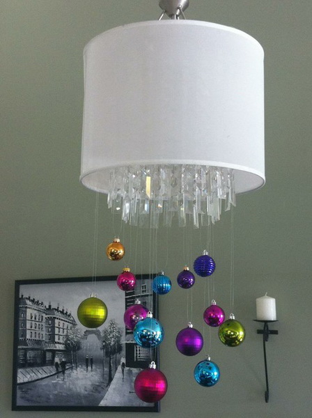 Beautiful crystal chandelier decorated with colorful ornaments.