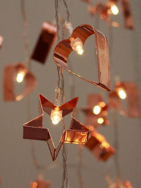 Cute copper cookie cutter in the string with light. 