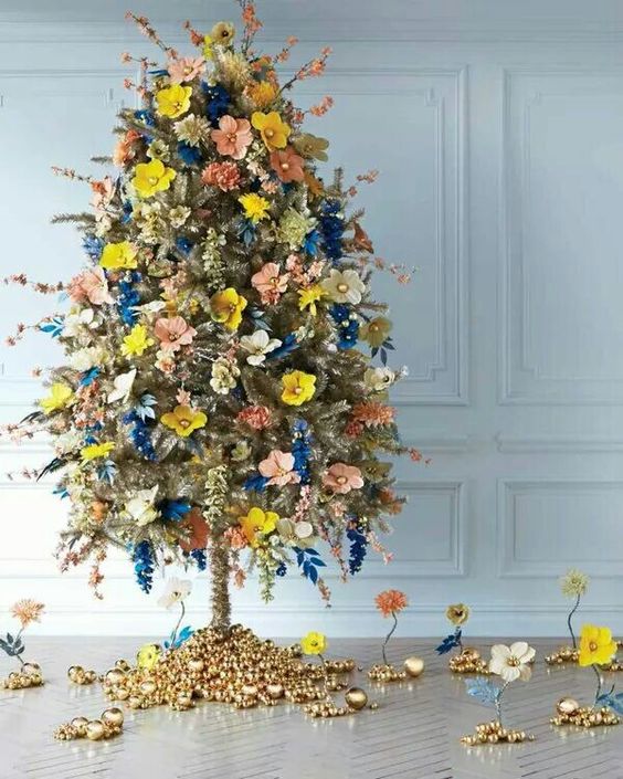 Exclusive Christmas tree decorated with colorful flowers with golden accent