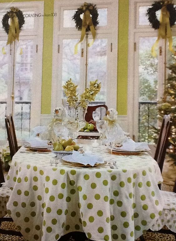 Go green with this dining room decoration with polka dots tablescape and wreath on windows.