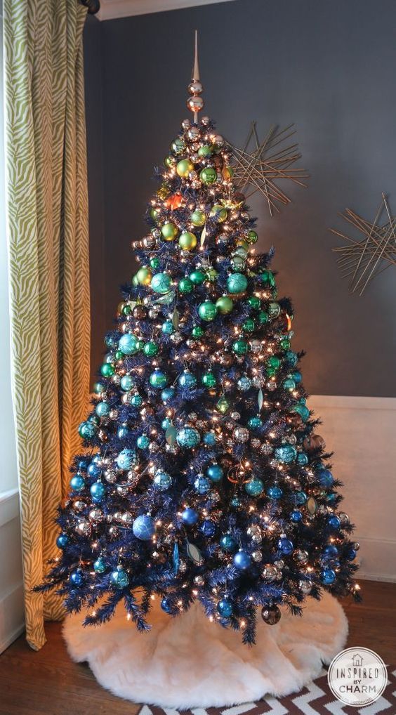 Gorgeous navy blue Christmas tree with green, copper, and blue balls