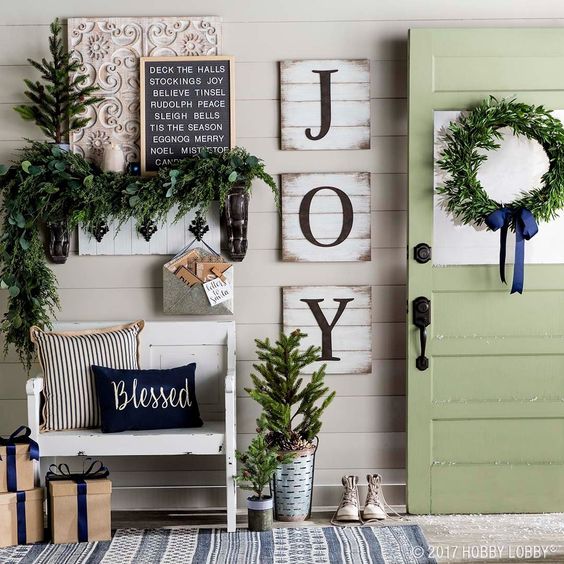 Impressive holly jolly Christmas entryway decoration.