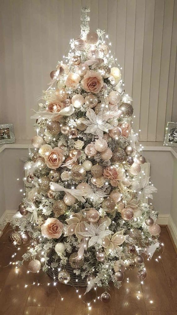 Marvelous rose gold and bush pink decoration on Christmas tree with lights