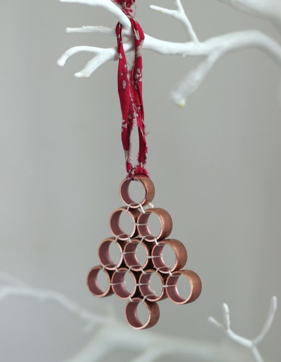 Pieces of copper pipe are arranged as ornaments.