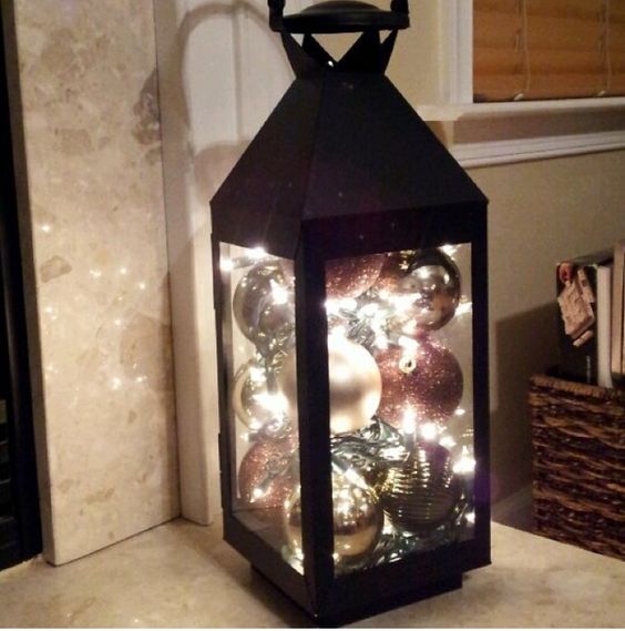 Put some ornaments with lights into lanterns.