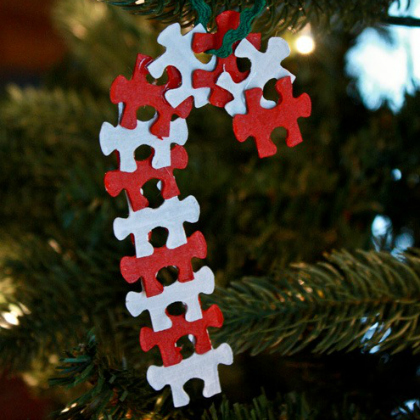 Puzzle pieces are arranged as candy cane Christmas ornaments.