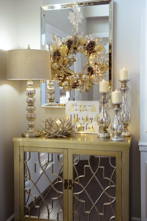 Stunning silver and golden Christmas entryway decoration.