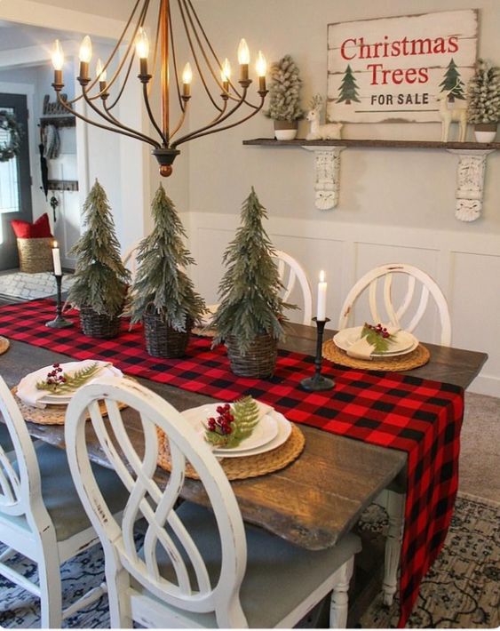 Tabletop Christmas tree, candles with red & black plaid table cover.