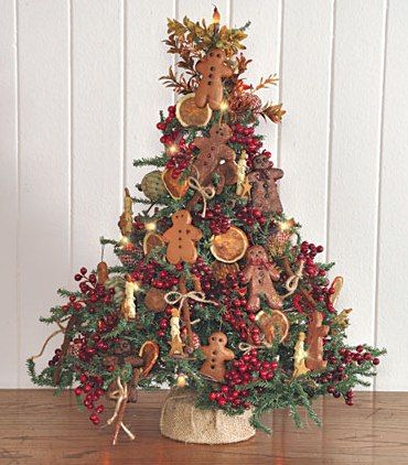 Tabletop Christmas tree with gingerbread ornaments.