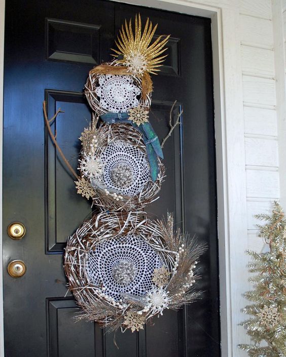 Traditional snowman wreath with dream catchers.