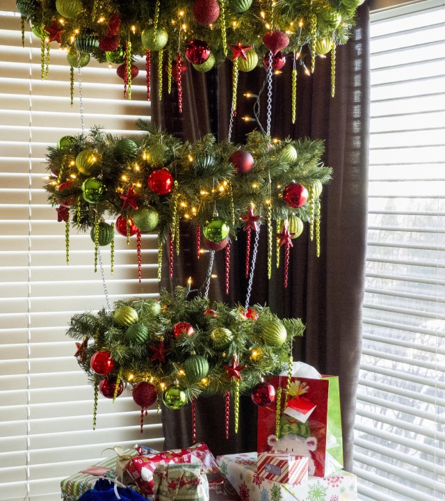 Use wreaths of varying sizes to create the appearance of an upside-down tree. 