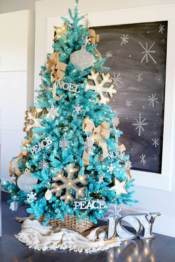 Wonderful sky-blue tree with letters, snowflakes, and a bow.