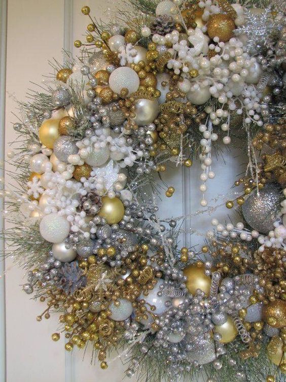 Adorable silver, white and golden Christmas wreath for door decoration.