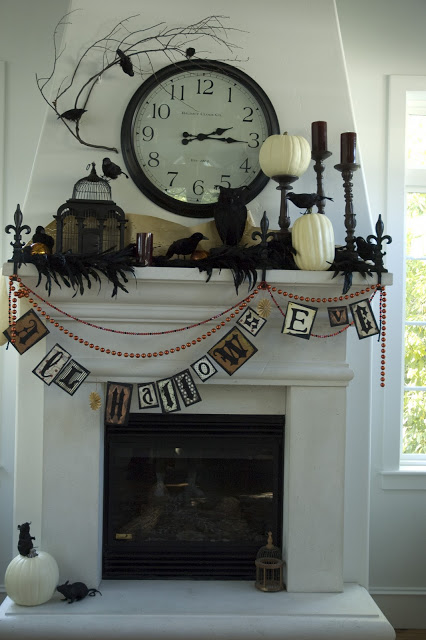 Charming clock centered mantel decor for Halloween