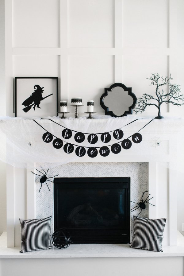 Elegant black and white Halloween mantel decor