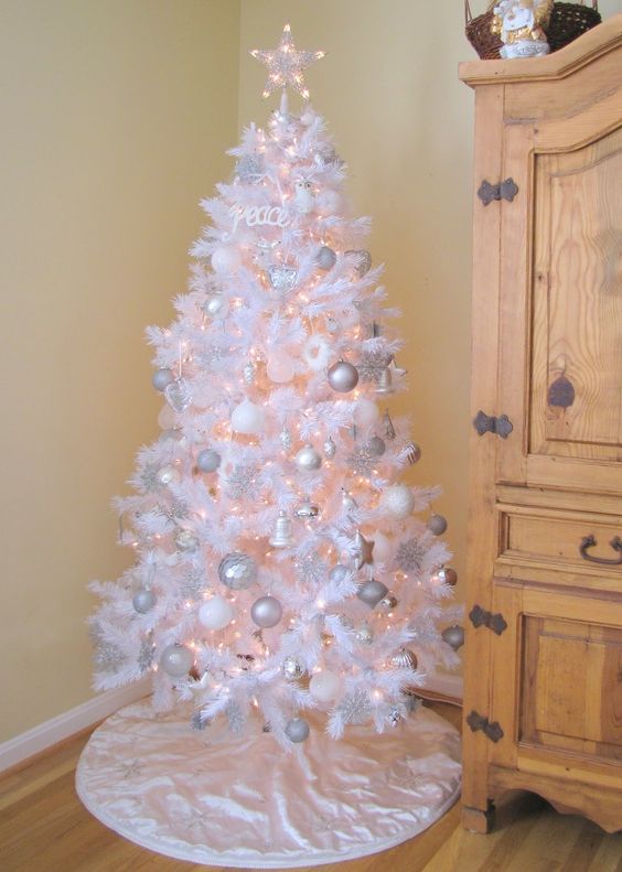 Feather white tree with silver hanging balls. 