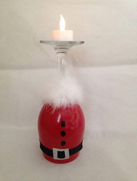 Glamorous Santa hand painted on wine glasses as candle holders