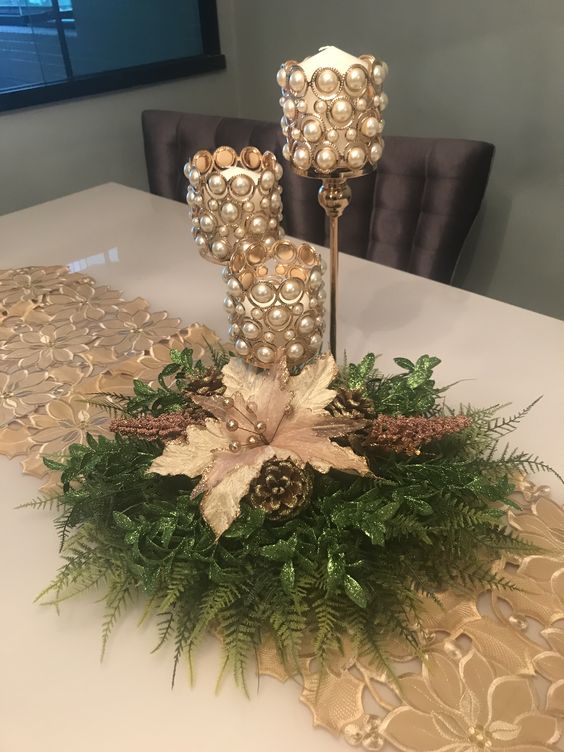 Gorgeous pearl decoration on wine glasses with flowers, pinecones and leaves