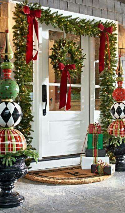 Green leaves garland and wreath with red bow