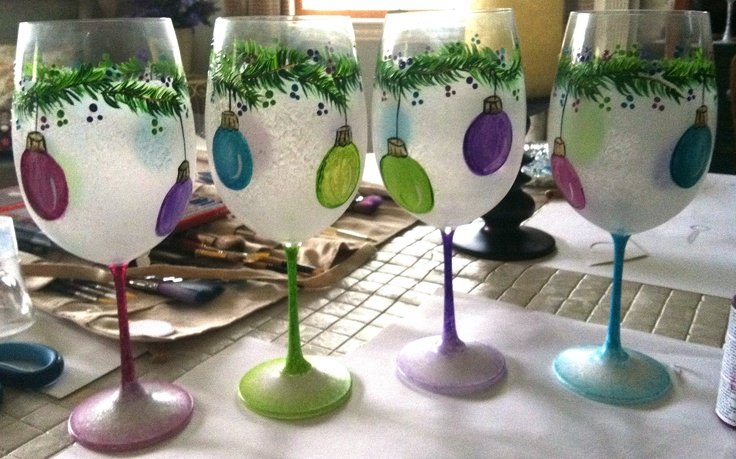 Hand painted garland with ornaments on wine glass. 