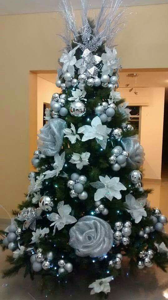 Handmade silver and white flowers with silver balls on the Christmas tree.