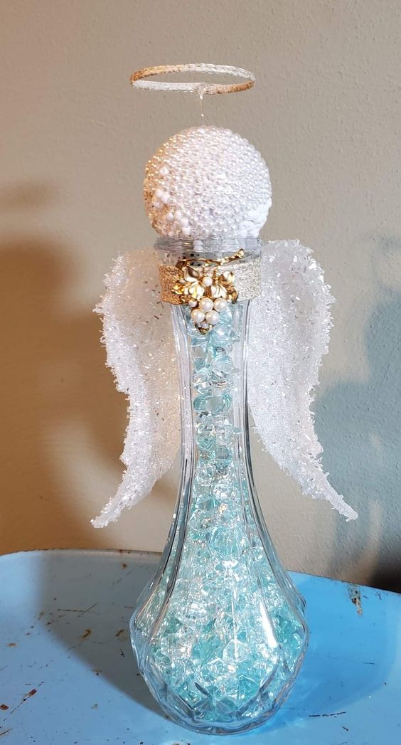 Impressive addition of little wooden angels, and silver glasses for Christmas decor