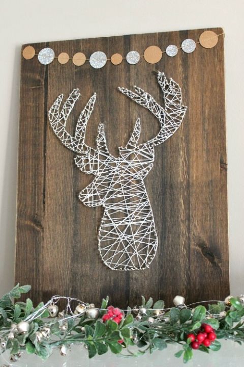 Impressive recycled wooden sign with a banner and a yarn and nail deer