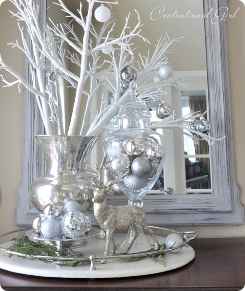 Pretty white branches with silver ornaments and reindeer.