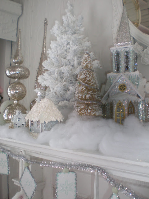 Swanky silver and white Christmas mantel decoration idea