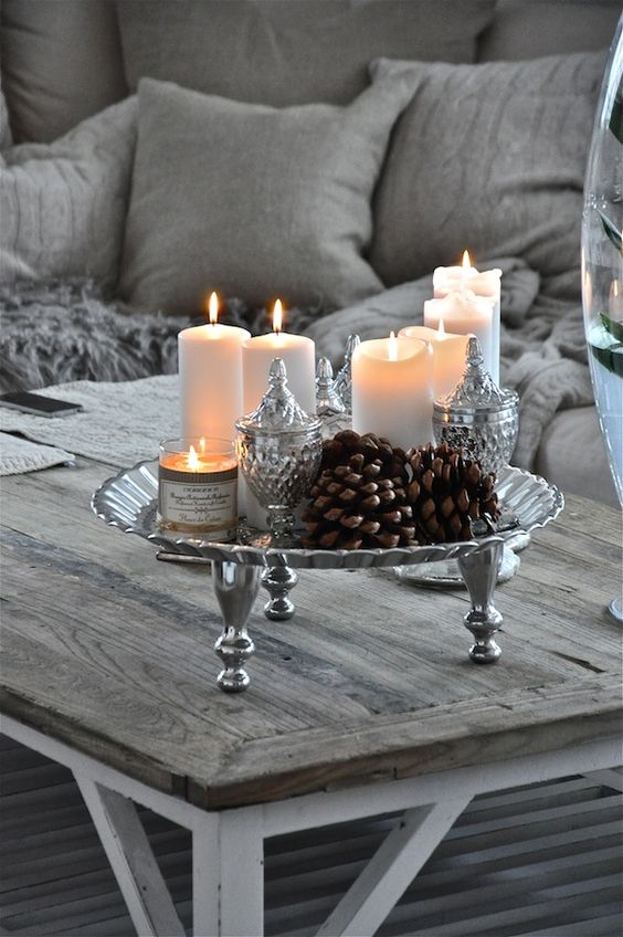 White candles with silver ornaments.