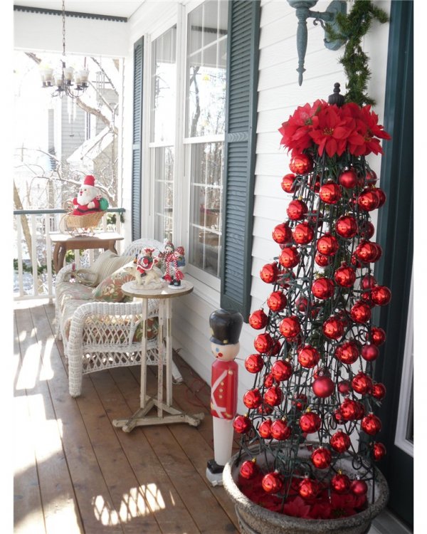 Wireframe Christmas tree decorated with red ornaments and Santa