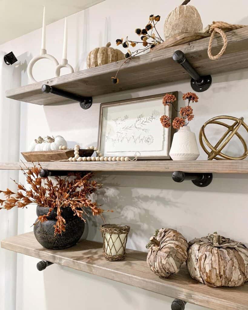 A Shelf of Rustic Pumpkins and Wild Florals