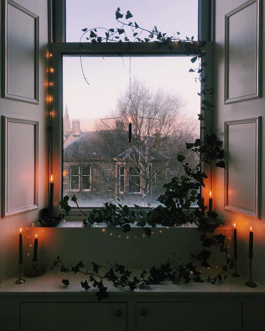 Cozy Window Nook with Candles and Greenery