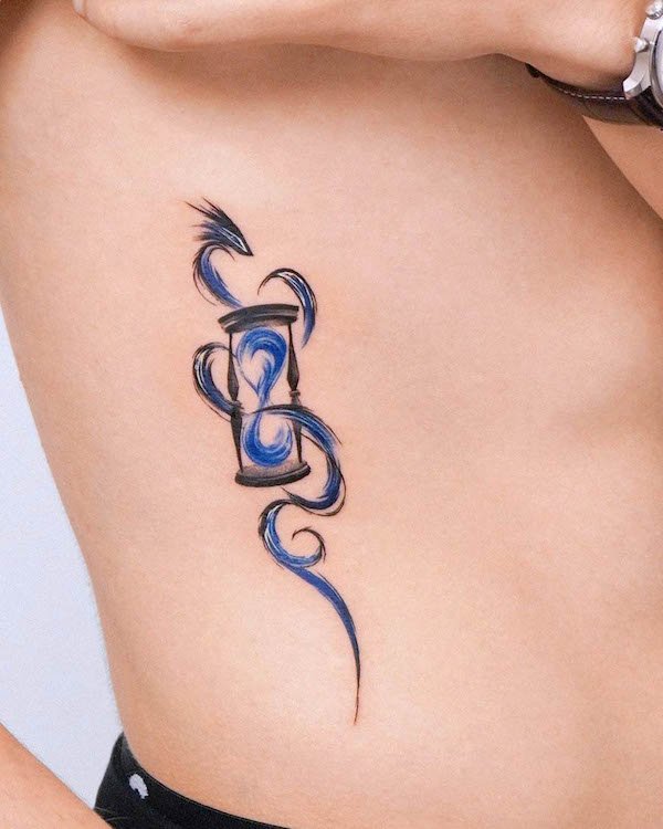 Abstract dragon and hourglass waist tattoo