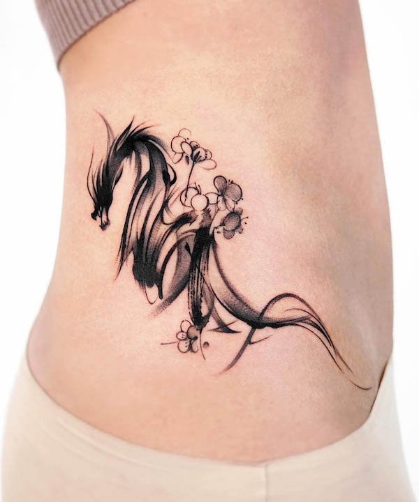 Abstract dragon side waist tattoo