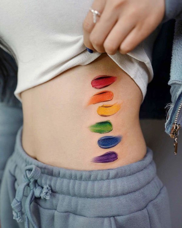 Realism rainbow paint stroke waist tattoo