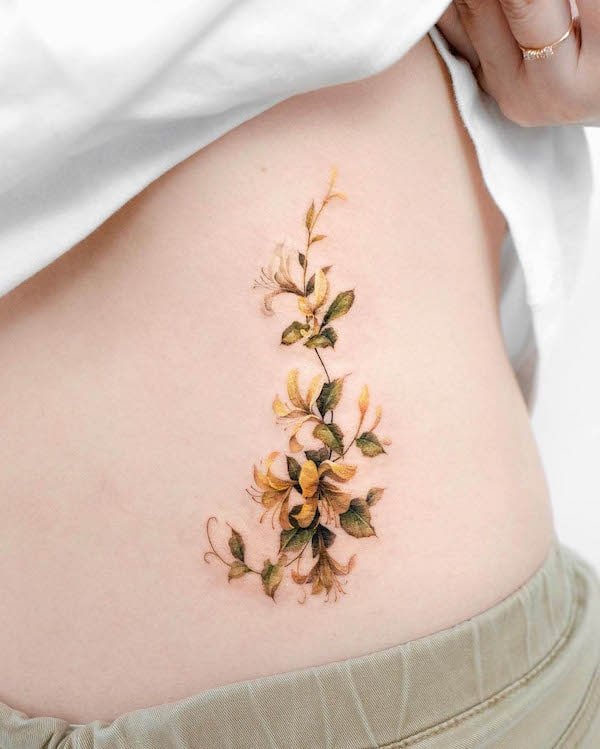 Golden honeysuckle waist tattoo