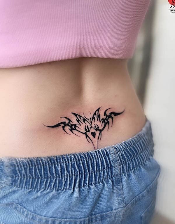 Lower back tribal butterfly tattoo