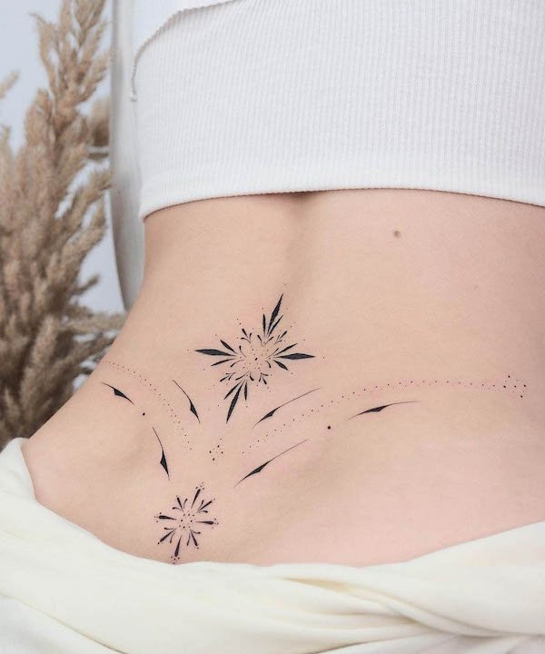 Ornamental lower back tattoo
